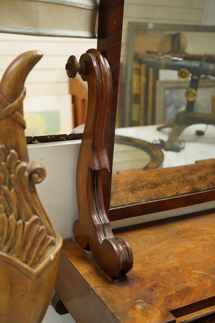 A mahogany toilet mirror and an oval wall mirror, 77cm wide